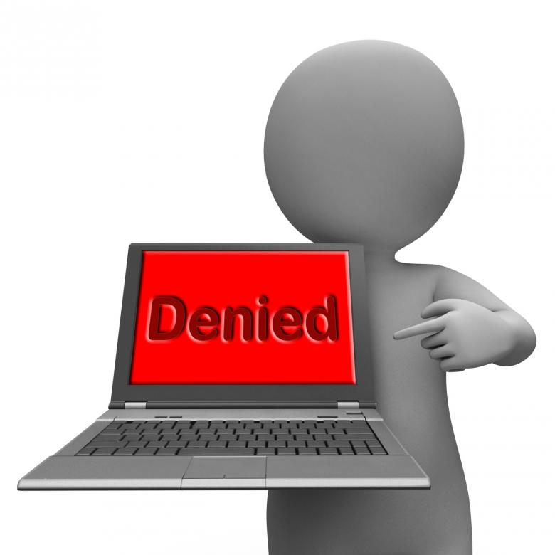 Person holding a laptop that says denied